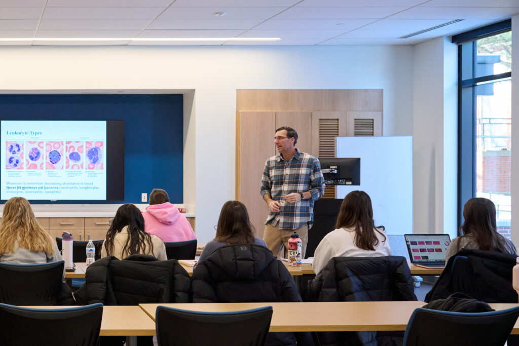 Faculty member Dr. Matt Ely teaching anatomy class in Mondor Center.